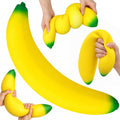 Jumbo Banana Squishy oversized soft yellow banana with green tips and stretching demonstration
