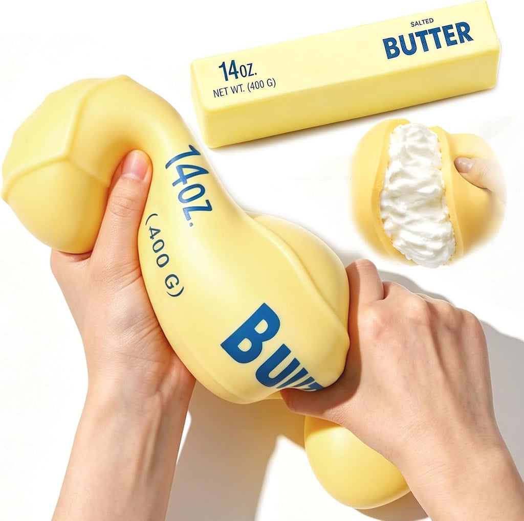 Jumbo butter squishy squeezed between hands with butter-stick prop